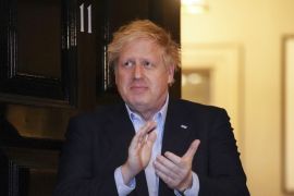 In this handout photo provided by 10 Downing Street, Britain''s Prime Minister Boris Johnson claps outside 11 Downing Street to salute local heroes during Thursday''s nationwide Clap for Carers NHS in