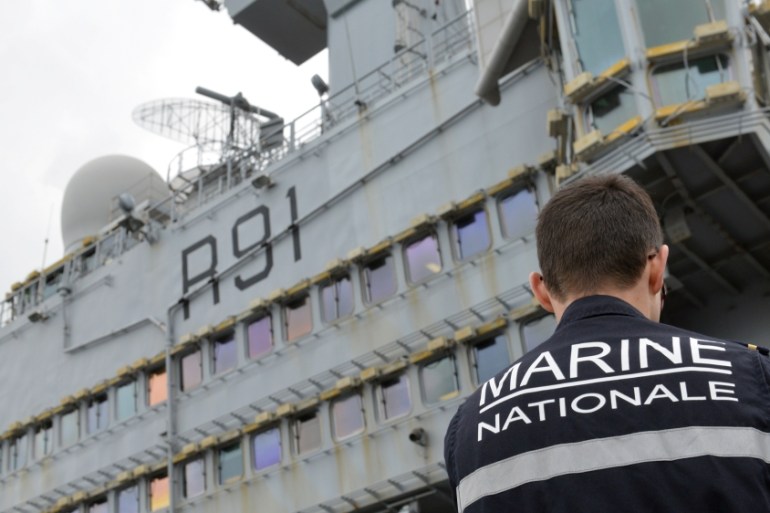 A French Navy sailor is seen onboard the Charles de Gaulle aircraft carrier, currently moored at the port of Limassol