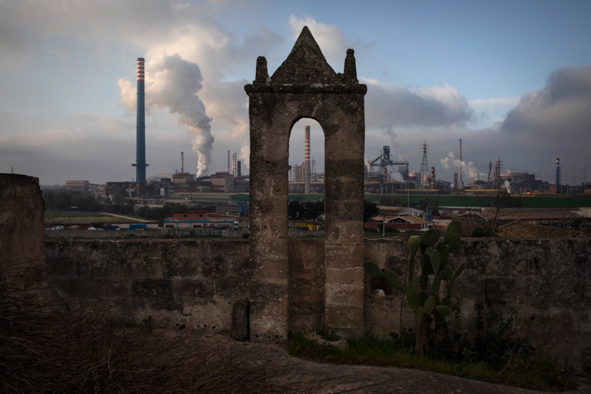 The Arcelor Mittal steel works factory dominates the skyline from an old abandoned “masseria”, an Italian fortified farmhouse on a country estate, in Taranto, southern Italy, March 9, 2019. During day