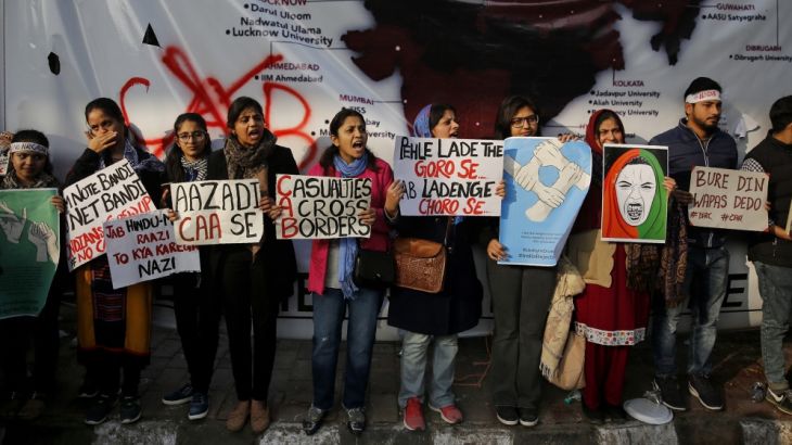 Indian students of the Jamia Millia Islamia University and locals participate in a protest demonstration against a new citizenship law in New Delhi, India, Saturday, Dec. 21, 2019. Critics have slamme