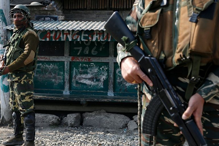 Indian paramilitary soldiers stand guard in Srinagar