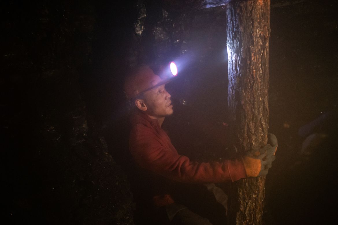 A man at work in an informal mine in Nalaikh, a poor urban district 36 km east of the capital Ulaanbaatar, Mongolia, January 16, 2019. Miners crawl in the darkness for hundreds of meters through narro