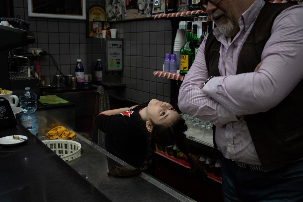 Gabriella, 8, behind the bar of a family friend in one of the neighbourhoods of Taranto, southern Italy, March 7, 2019. In 2015 Gabriella was diagnosed with leukemia, a cancer of the body''s blood-form