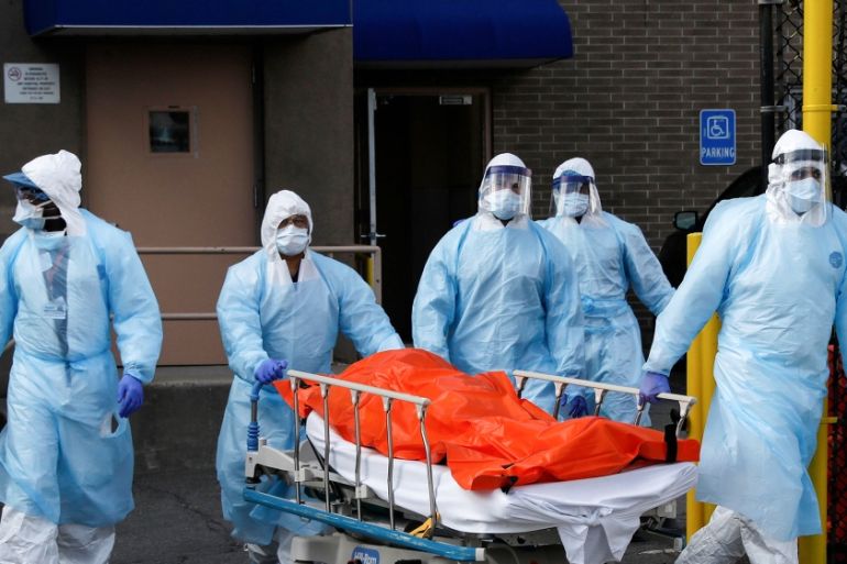 Healthcare workers wheel the body of deceased person from the Wyckoff Heights Medical Center during the outbreak of the coronavirus disease (COVID-19) in the Brooklyn borough of New York City, New Yor