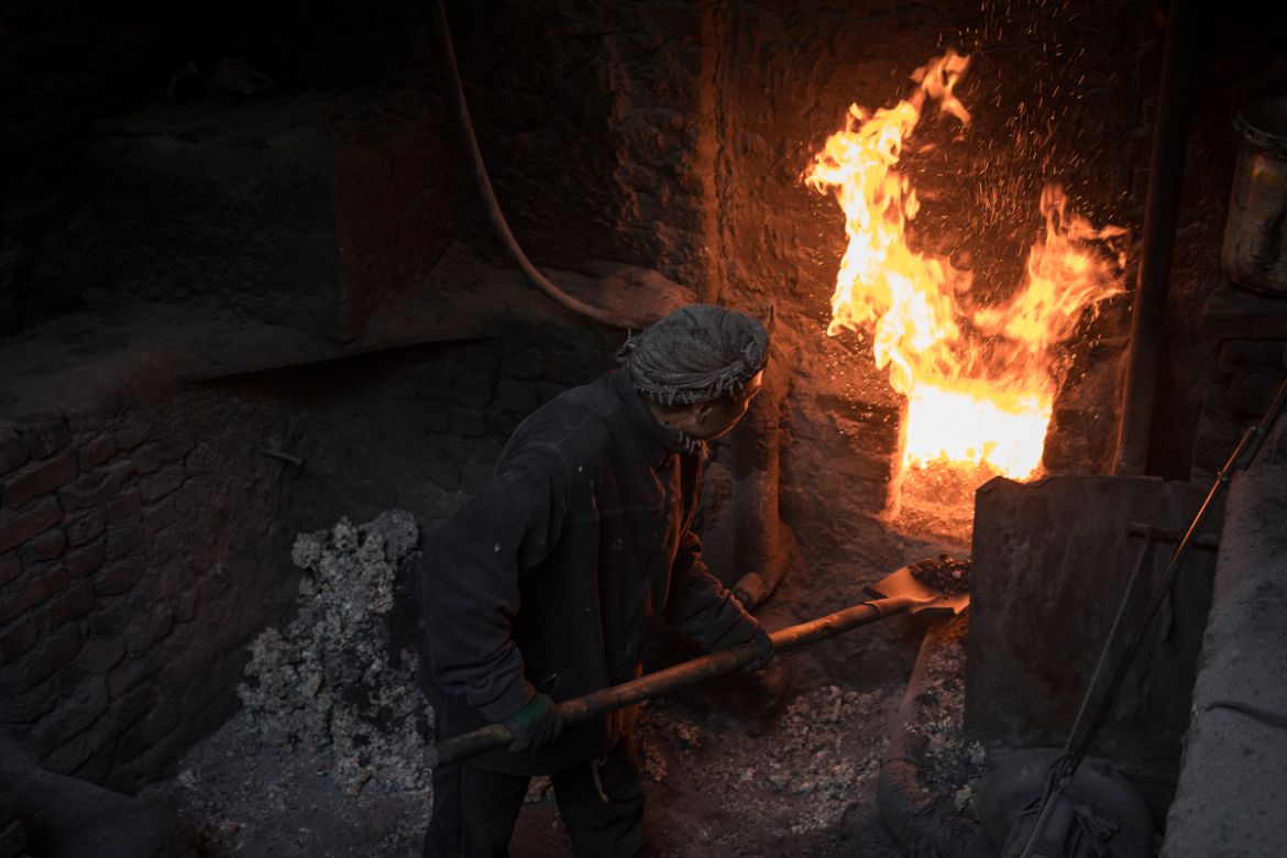 A man feeds coal into the furnace of a steam boiler of a public bath house in Kabul, Afghanistan, February 1, 2020. With few homes in Afghanistan having their own private bathrooms, communal bath hous