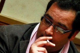 Ziad al-Elaimy Member of Parliament (MP) from the Egyptian Social Democratic Party, smokes a cigarette before a parliament session in Cairo February 26, 2012. Ziad al-Elaimy was
