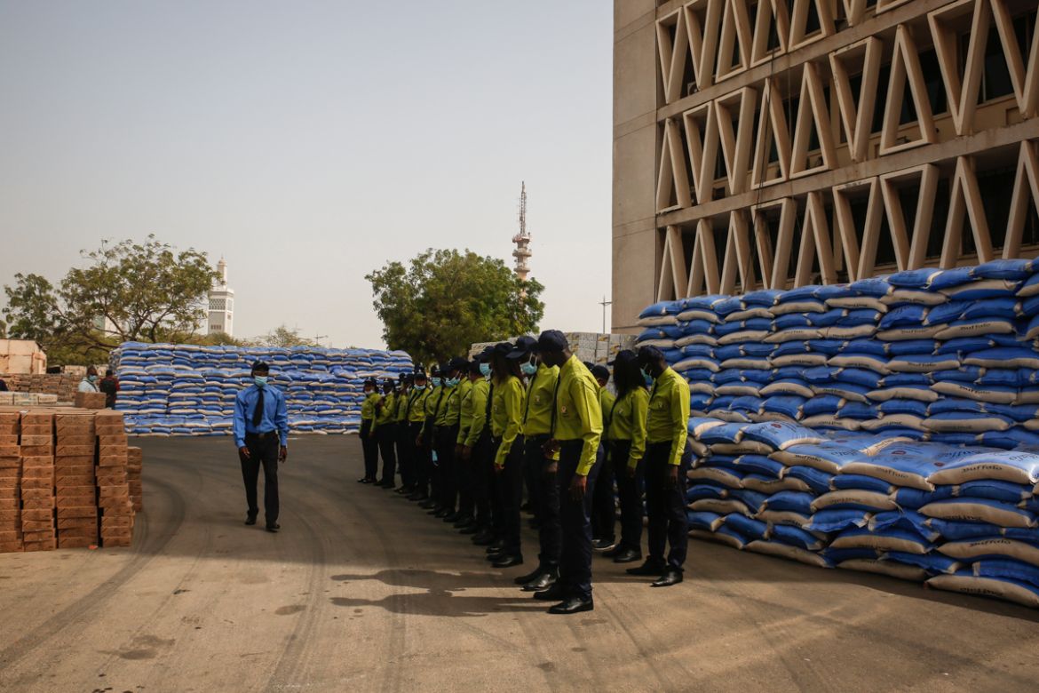 Volunteers from Dakar’s city hall stand by food supplies ready for distribution to 19 districts of Dakar. At the onset of the coronavirus crisis in the country, the Senegalese government started conti