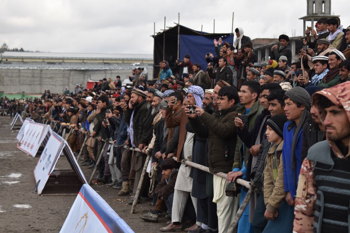 Crowds cheer as a game between Baghlan and Bamyan province takes place on the second day of the Buzkashi league at Chaman-e-Hazouri stadium in Kabul, on Thursday. Photo by Hikmat Noori