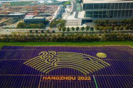 This aerial photo taken on March 26, 2019 shows different coloured flowers used to create the logo of the 19th Asian Games near the under-construction venues in Hangzhou in China''s eastern Zhejiang p