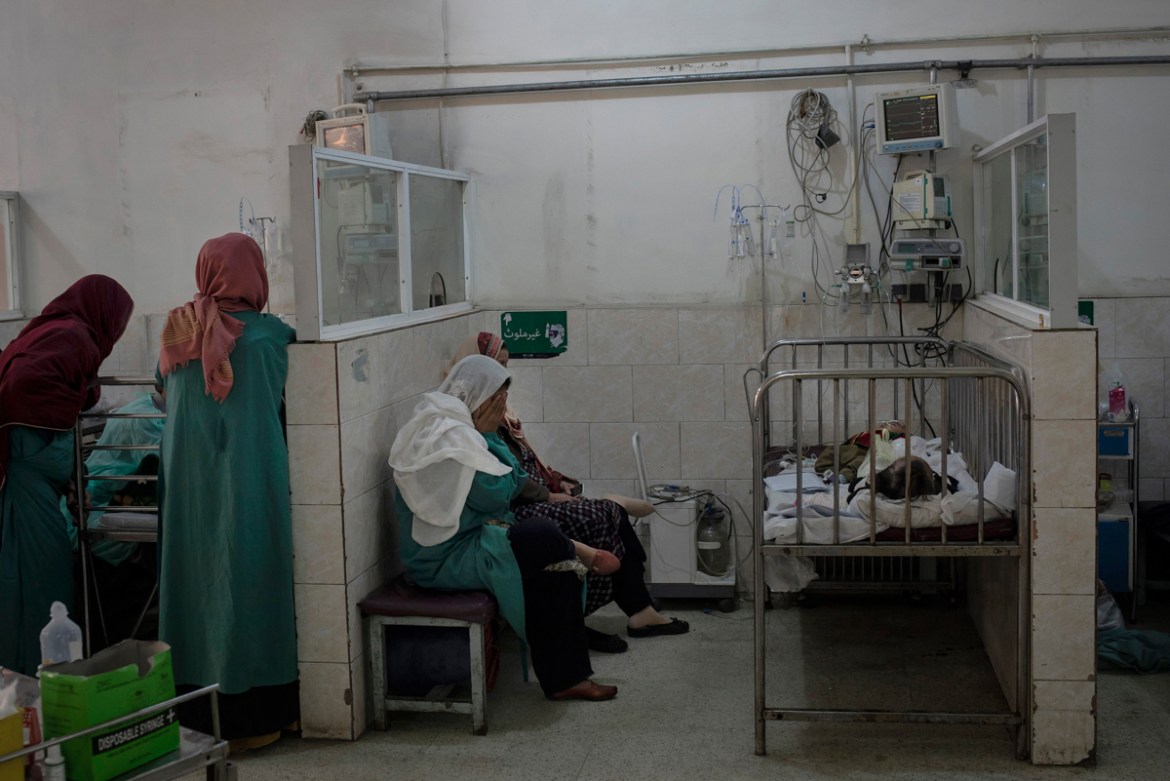 A mother gestures in grief as others stand close to the beds of their children suffering from lung infections at a government run hospital in Kabul, Afghanistan, January 30, 2020. Doctor Farid Ahmad A