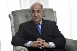 Algerian President Abdelmadjid Tebboune meets with the visiting French Foreign Minister (unseen) in the capital Algiers on January 21, 2020. Le Drian arrived to Algiers for a brief visit to discuss bi