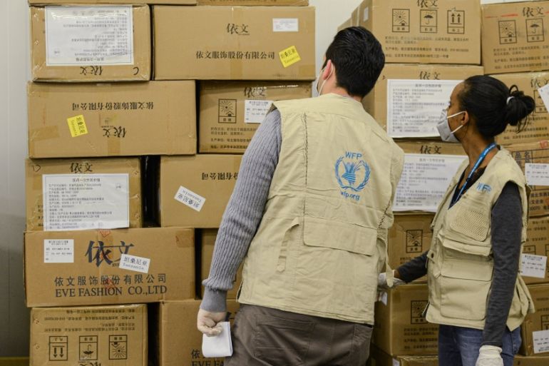 Staff of the World Food Programme (WFP) check arrived boxes, mostly personal protective equipment (PPE), at Ethiopian Airlines'' cargo facility at the Bole International Airport in Addis Ababa, Ethiopi