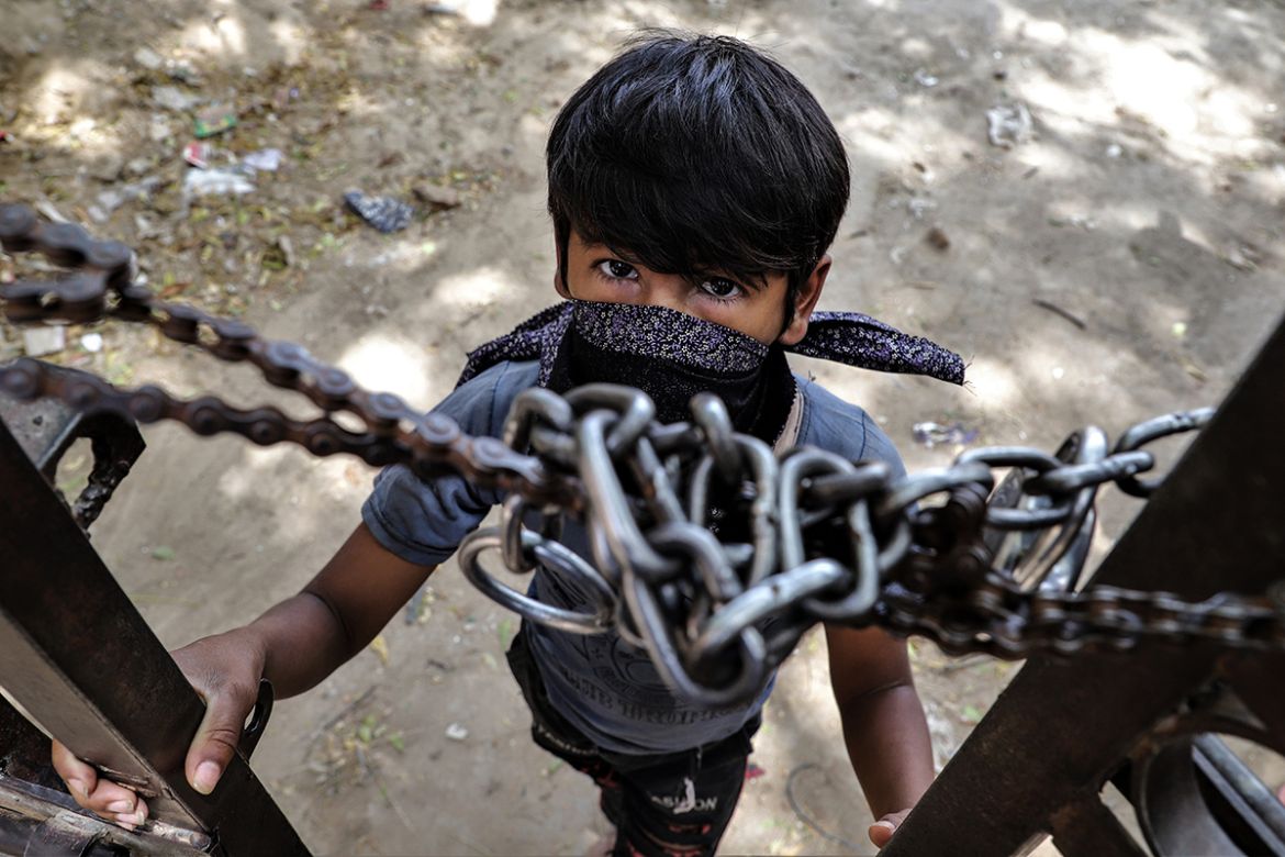 Salahuddin Sheikh, 9, from West Bengal’s Murshidabad town is stuck in Delhi-NCR with his father, Akbar Sheikh, 45 who works as a mason. He has not been working for a litter over a month now which adde