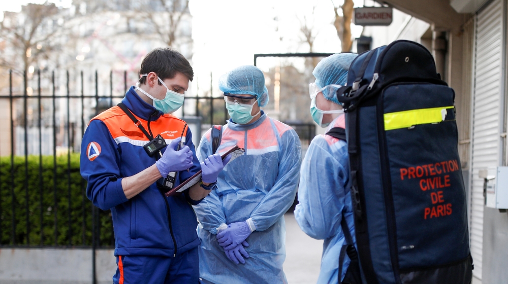 Members of the French Civil Protection service arrive on site for a rescue operation in Paris, as the spread of the coronavirus disease (COVID-19) continues in France, April 4, 2020. Picture taken Apr