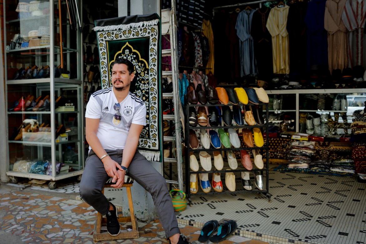 Sidi Azouzi, a Senegalese of Moroccan descent who manages a string of stores selling Moroccan goods on a busy downtown commercial street of Dakar, laments the lull in business activity due to the coro