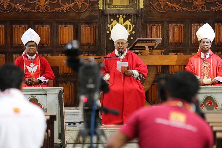 epa08355762 Archbishop of Colombo Cardinal Malcolm Ranjith (C) holds an online Good Friday service at the almost deserted all Saints church†during an island-wide curfew,†in Colombo, Sri Lanka, 10 Apri