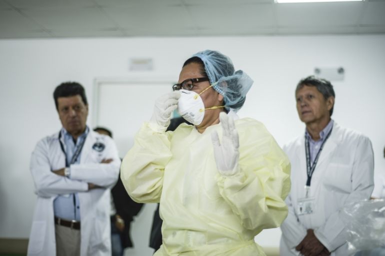 Coronavirus precautions in Guatemala- - VILLA NUEVA, GUATEMALA - MARCH 07: A nurse shows the process of how to protect themselves from coronavirus at the National Hospital, where patients carrying the