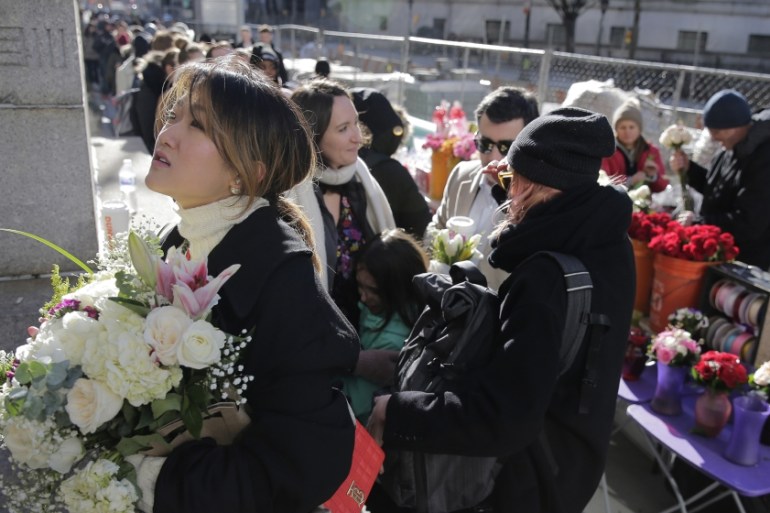 Couples and their friends and families wait in a long line to enter the New York City Marriage Bureau on Valentine''s Day in New York, Friday, Feb. 14, 2020. (AP Photo/Seth Wenig)