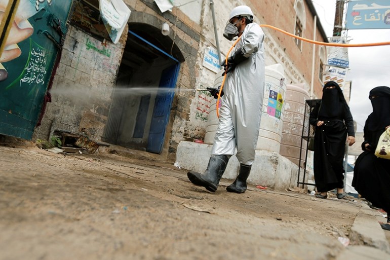 A health worker wearing a protective suit disinfects a market amid concerns of the spread of the coronavirus disease (COVID-19), in Sanaa, Yemen April 28, 2020. REUTERS/Khaled Abdullah