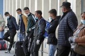 Seasonal workers heading to Germany wait at Bucharest Airport, during the outbreak of the coronavirus disease (COVID-19), in Romania on April 17, 2020 [Inquam Photos/Octav Ganea via Reuters]