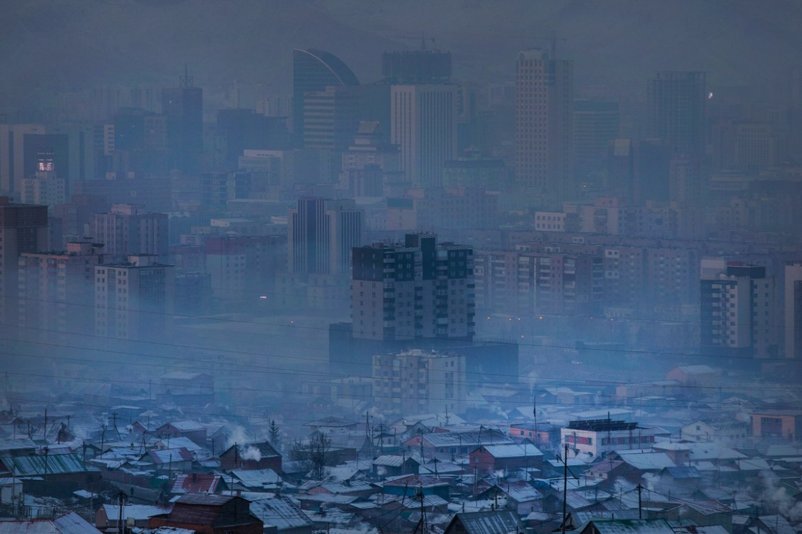 Heavy pollution engulfs the capital Ulaanbaatar in the early hours of the morning when residents are waking up and burning larger quantities of coal in their homes, January 14, 2019. The surrounding h
