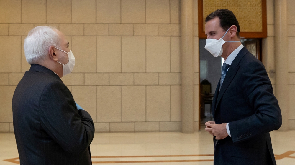 Syria's President Bashar al-Assad meets with Iran's Foreign Minister Mohammad Javad Zarif in Damascus