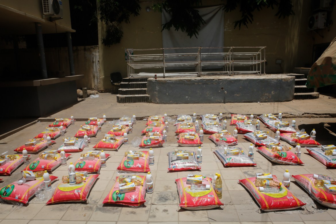 Rations of rice, cooking oil, bleach and sugar are prepared for an aid distribution organized by the Mermoz district of Dakar. The Senegalese government has purchased tonnes of rice, pasta, sugar and