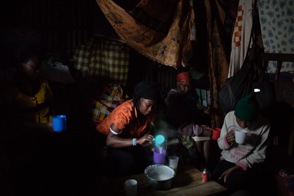A woman prepares breakfast for her family who share a small room in the slum of Korogocho close to the rubbish dump of Dandora in the capital Nairobi, Kenya, February 21, 2019. Fifteen people between