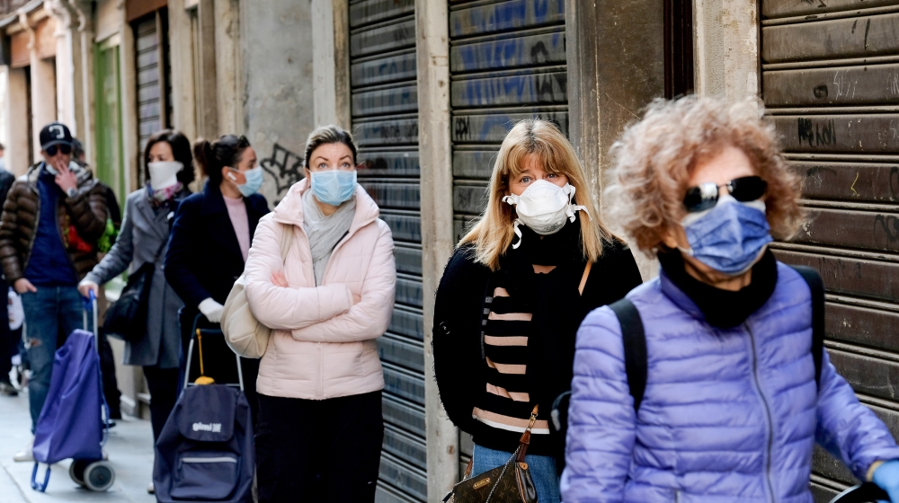 Customers queue at the Rialto fish market, as new restrictions for open-air markets are implemented by the Veneto region to prevent the spread of the coronavirus disease (COVID-19), in Venice, Italy, 