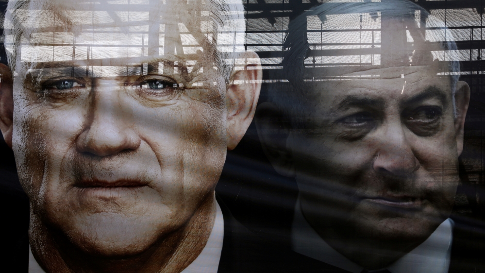 A banner depicts Benny Gantz, leader of Blue and White party, and Israel Prime minister Benjamin Netanyahu, as part of Blue and White party's campaign ahead of the upcoming election, in Tel Aviv