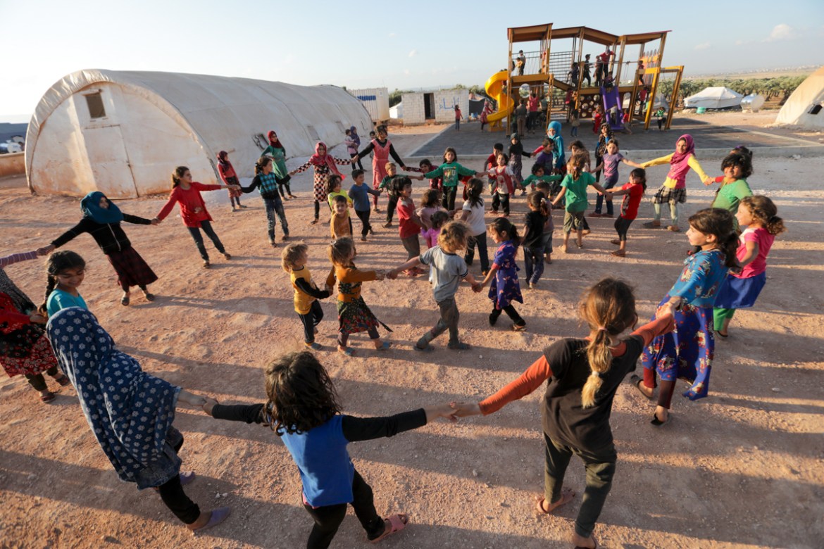 Displaced Syrian children play at a camp near the town of Maaret Misrin in Syria''s northwestern Idlib province on May 23, 2020, ahead of the Muslim holiday of Eid al-Fitr which marks the end of the fa