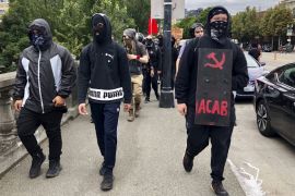 Anti-fascist counter-demonstrators cross the Burnside Bridge across the Willamette River from the west side of the city to the east side in search of the far-right group, the Proud Boys, in Portland,