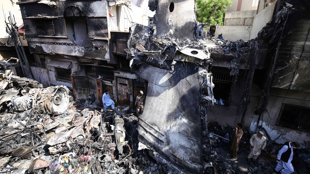 Wreckage of state run Pakistan International Airlines, Airbus A320 is lying amid houses of a residential colony days after it crashed, in Karachi, Pakistan, 24 May 2020. The death toll in a plane cras