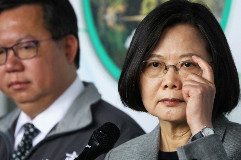 Taiwanese president Tsai Ing-Wen answers the media during a visit to a non woven filter fabric factory, where the fabric is used to make surgical face masks, in Taoyuan