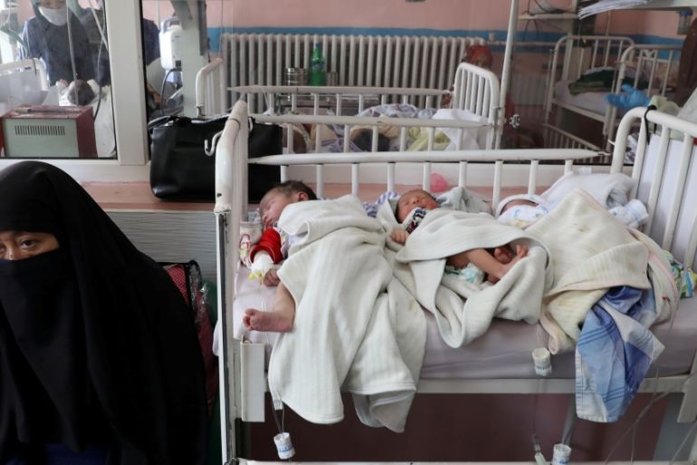 Newborn children who lost their mothers during the yesterday''s attack lie on a bed at a hospital, in Kabul
