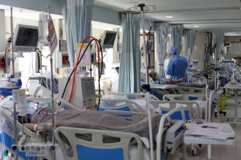 Patients with coronavirus disease (COVID-19) lie in beds at the ICU of Sasan Hospital, in Tehran