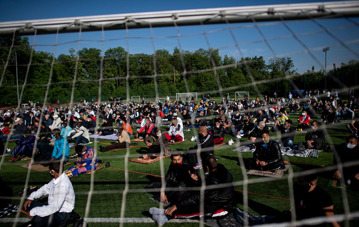 epa08440666 Muslims attend a morning prayer session to celebrate Eid al-Fitr, which marks the end of Ramadan, at Lokomotiv Stadium in Sofia, Bulgaria, 24 May 2020. Muslims around the world are celebra