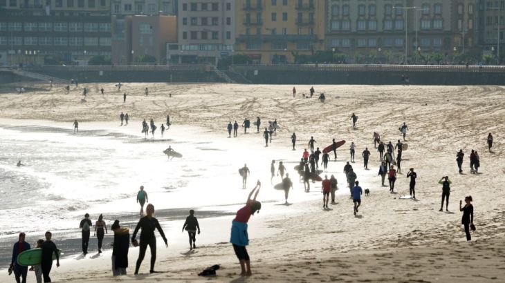 People exercise at Zorriola beach after adults were allowed out to exercise for the first time in seven weeks, as the government began easing coronavirus disease (COVID-19) restrictions,