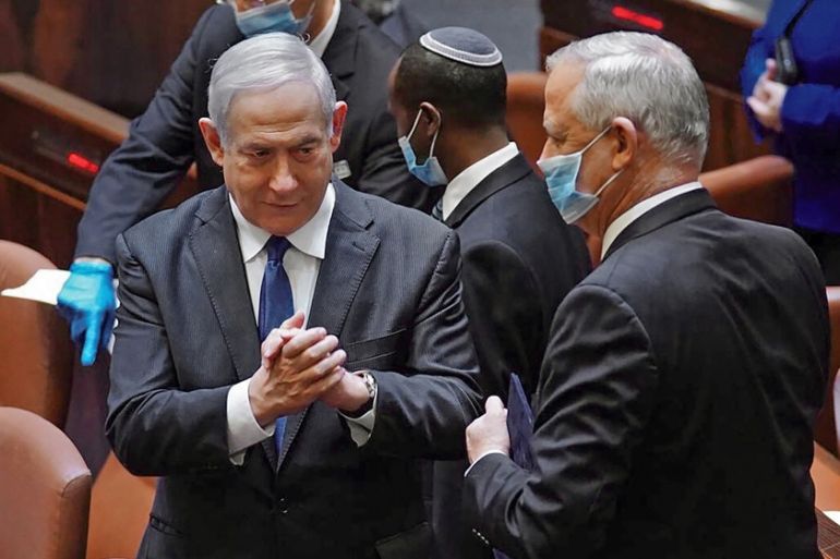 A handout picture released by the Israeli Knesset (parliament) spokesperson''s office on May 17, 2020, shows Israeli Prime Minister Benjamin Netanyahu (L) and alternate MP Benny Gantz, during the swear