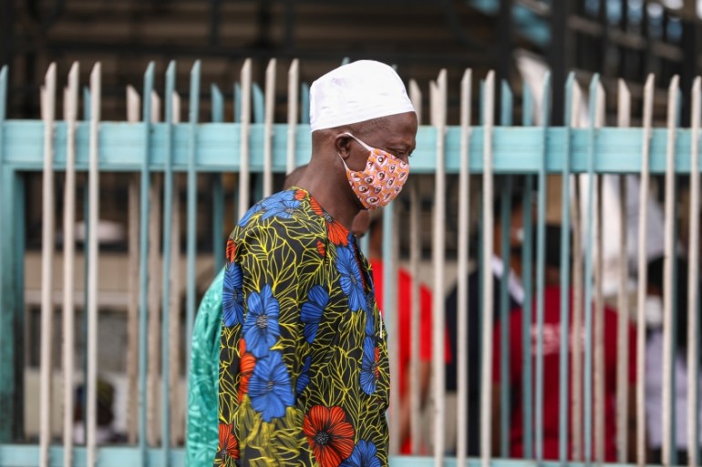 A man wearing a protective face mask is seen on the first day of the easing of lockdown measures during the outbreak of the coronavirus disease (COVID-19) in Lagos