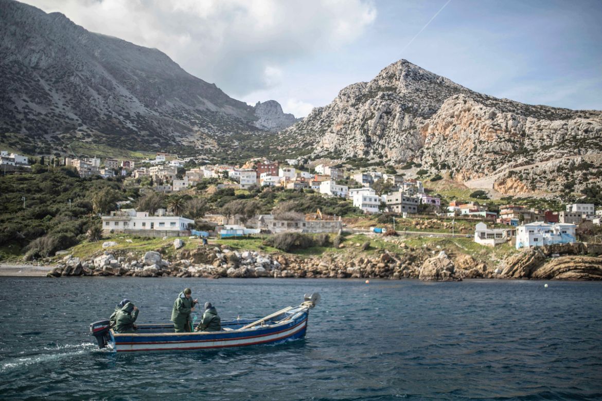 In this Wednesday, Feb. 12, 2020 photo, members of the first Moroccan female fishing cooperative go out to sea in a fishing boat, in the village of Belyounech on the coast of the Mediterranean, northe