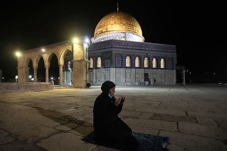 A muslim woman pray next to the Dome of the Rock Mosque in the Al Aqsa Mosque compound in Jerusalem''s old city, Sunday, May 31, 2020.The Al-Aqsa mosque in Jerusalem, the third holiest site in Islam, r