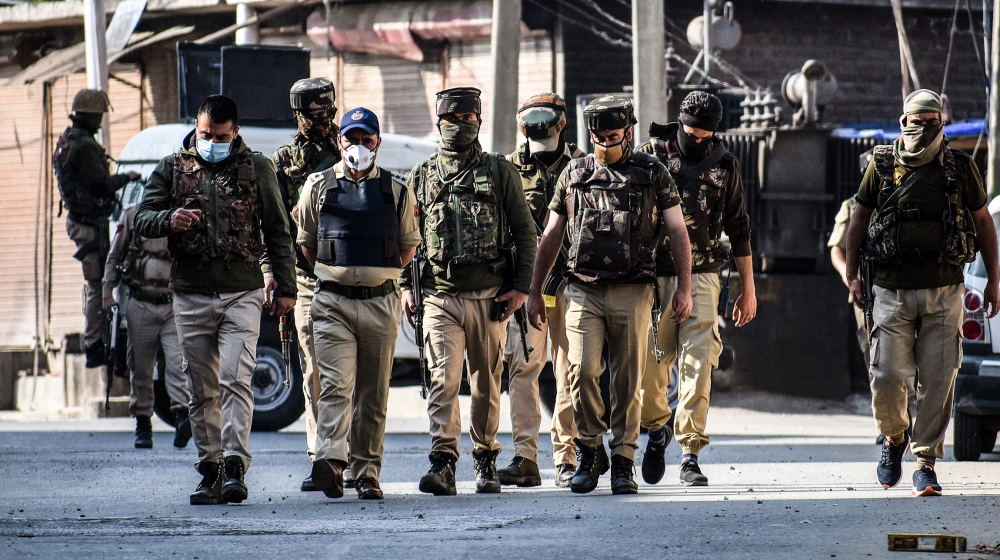Indian policemen are seen near the gun-battle site in old city Srinagar,Kashmir where two militants were killed on May 19, 2020.Director General of J&K police Dilbagh Singh said that the one of the tw