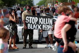 Protesters gather at the scene where George Floyd, an unarmed black man, was pinned down by a police officer kneeling on his neck before later dying in hospital in Minneapolis, Minnesota, U.S. May 26,