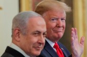 US President Donald Trump waves next to Israel's Prime Minister Benjamin Netanyahu prior to announcing his Middle East plan in Washington on January 28, 2020 [Reuters/Brendan McDermid]