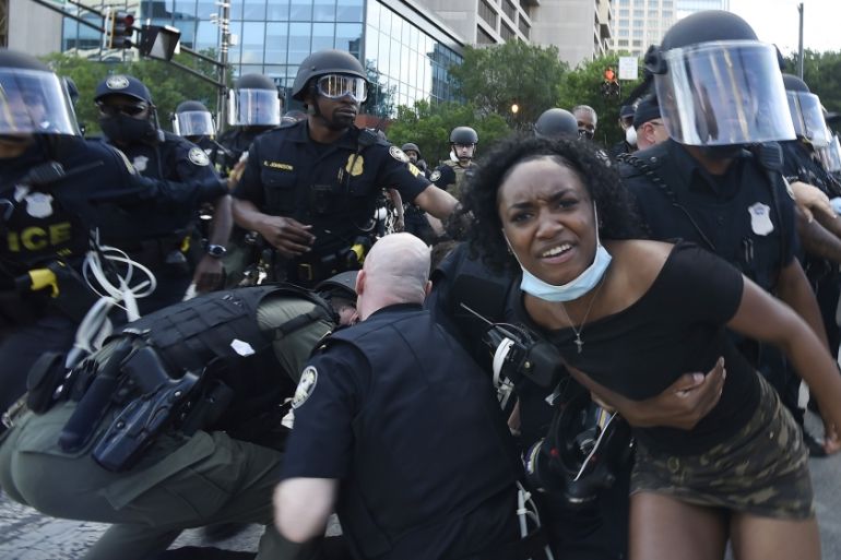 Atlanta Police detain demonstrators protesting, Saturday, May 30, 2020 in Atlanta. The protest started peacefully earlier in the day before demonstrators clashed with police. Demonstrators took to the