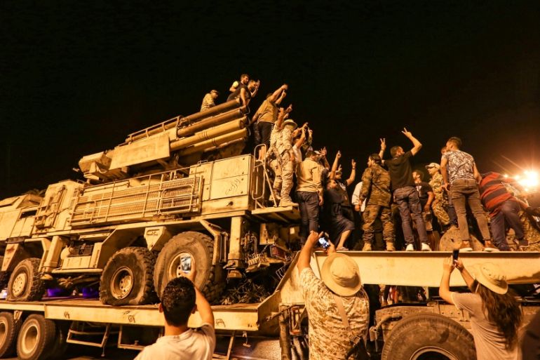 Libyan government displays destroyed air defense system used by warlord Haftar''s militias- - TRIPOLI, LIBYA - MAY 20: Libyan people gather at Martyrs Square to inspect Russian-made Pantsir-type air de