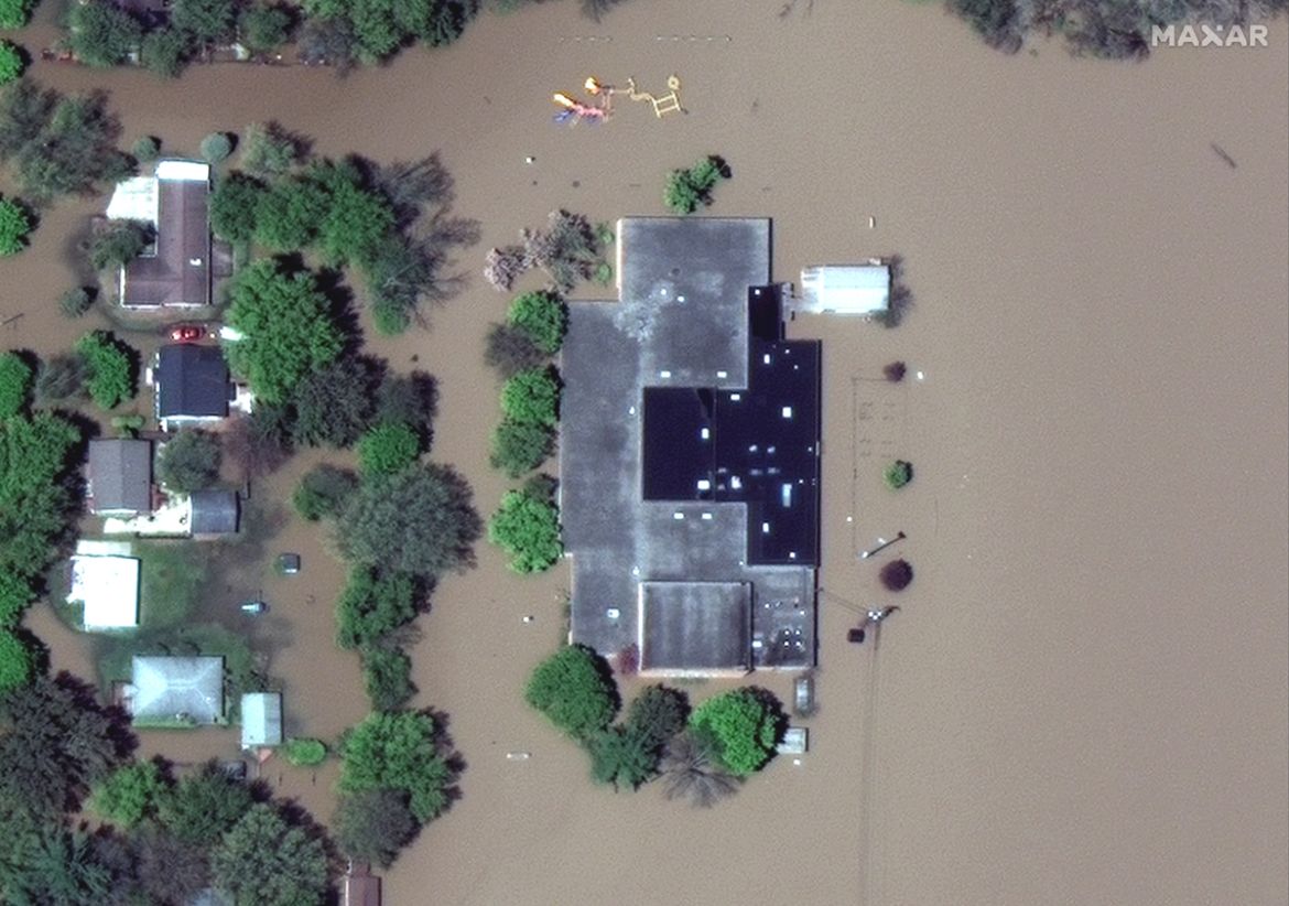 A satellite image shows a flooded Windover High School after rising floodwaters unleashed by two dam failures submerged parts of Midland, Michigan, U.S. May 20, 2020. Satellite image ?2020 Maxar Techn