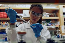 A researcher works in a lab at the Duke-NUS Medical School, which is developing a way to track genetic changes that speed testing of vaccines against the coronavirus disease (COVID-19), in Singapore