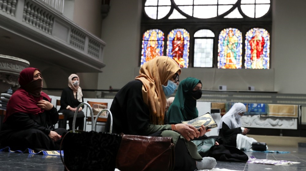 Muslims pray inside the evangelical church of St. Martha's parish, during their Friday prayers, as the community mosque can't fit everybody in due to social distancing rules, 